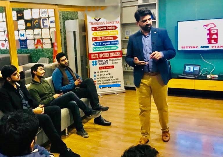 Public speaker training seminar with audience